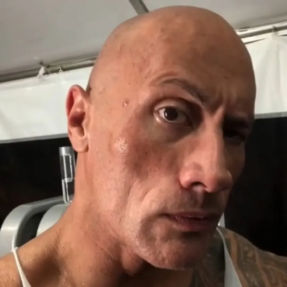 photo of dwayne the rock johnson looking at you in a suspicious way
