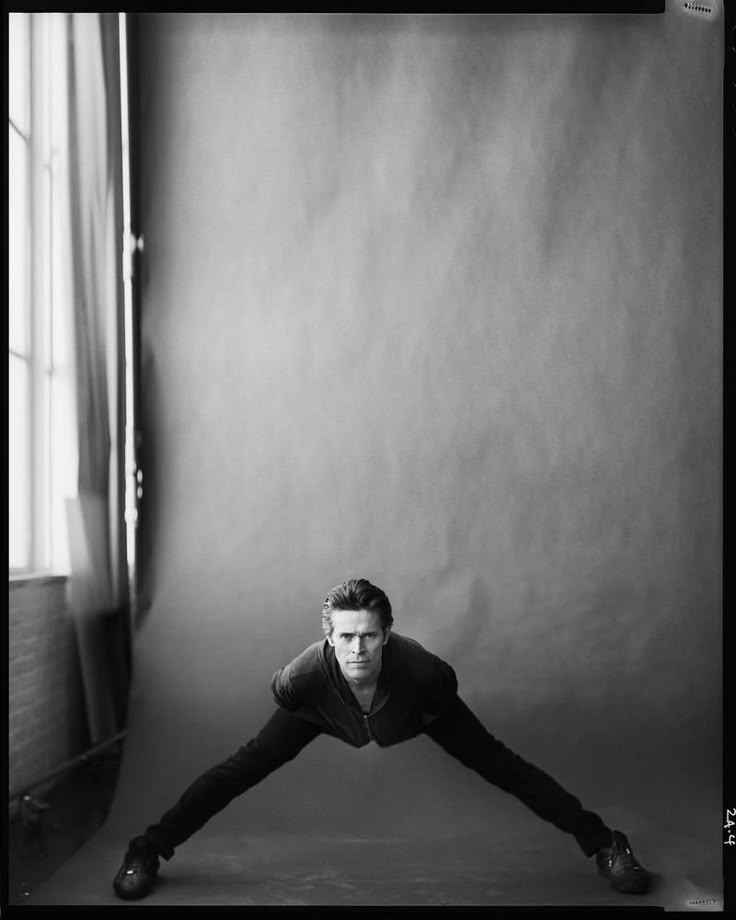 willem dafoe doing yoga or something